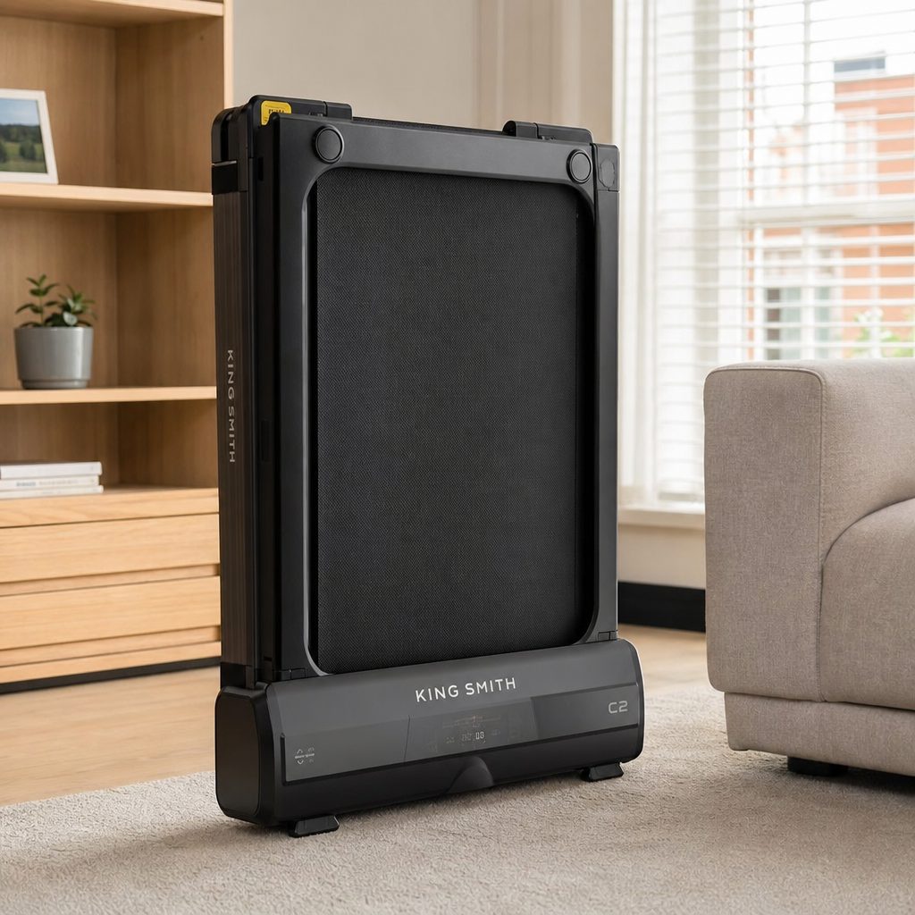 The C2's folding construction is the central feature: it is a walking pad for people whose office is also, inconveniently, their living room.